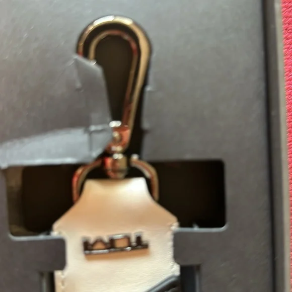 New in box Tumi leather strap- never removed from box - box has small damage
